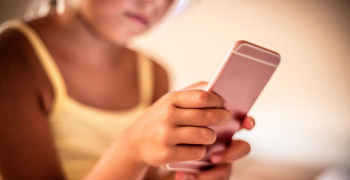 Blurred girl on mobile device