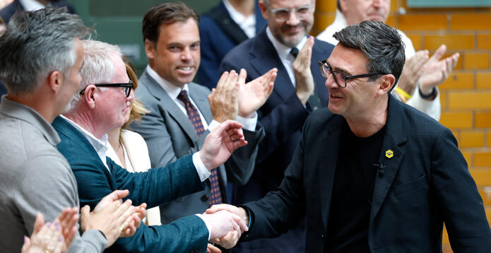 Andy Burnham greets audience member at Manchester speech