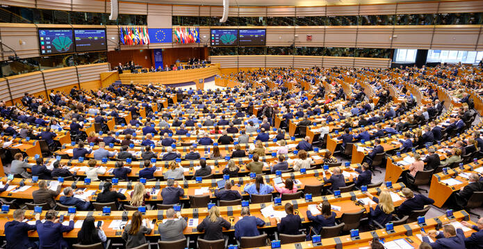 Members of the European Parliament vote during a plenary session of the European Parliament in Brussels, Belgium