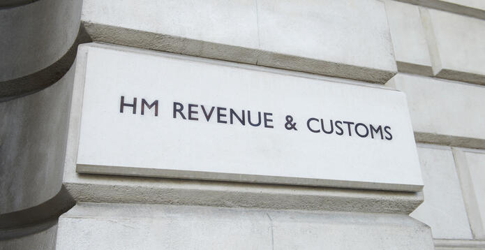 HMRC signage on building brick
