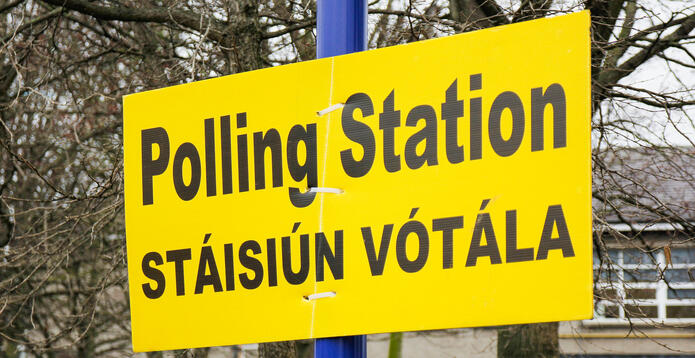 Polling station sign in English and Irish