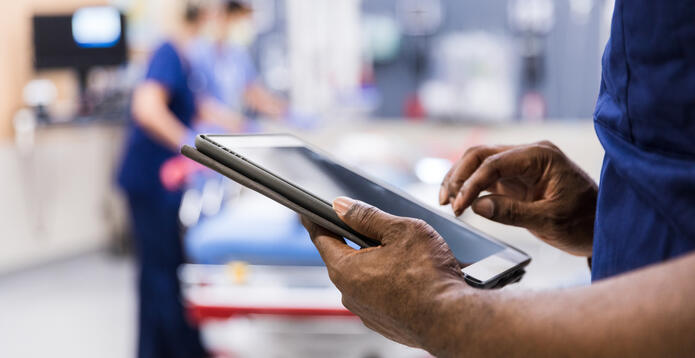 Doc using digital tablet_Digital - Website - Standard ImageCard