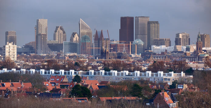 A skyline of administrative and residential high-rises emerges from the dunes in The Hague, Netherlands.