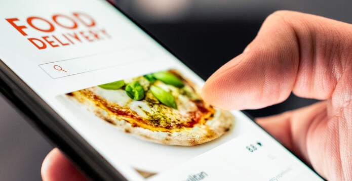Food and pizza delivery with phone from restaurant. Online app order. Take away menu on website. Quick takeout service. Deliver home fast. Smartphone application in screen.