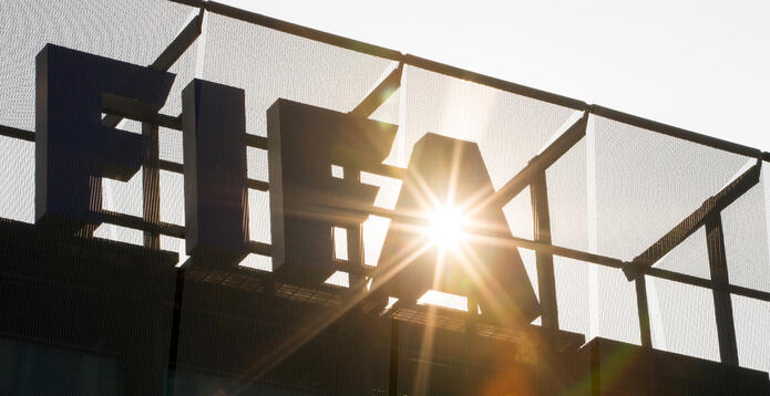 A FIFA logo sits on the rooftop at the FIFA headquarters in Zurich