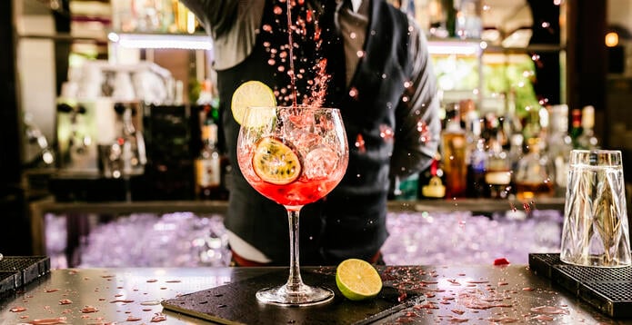 Drink being poured by barman