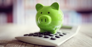 Green finance piggy bank with calculator-695