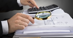 Businessperson Checking Invoice - audit