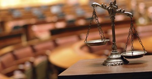 Decorative scales of justice in the courtroom