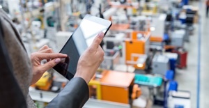 Female manager working on tablet in factory card