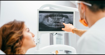 Dentist checking x-ray