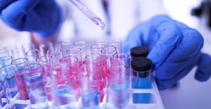 Lab technician working with test tubes