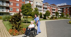 nurse pushing a wheelchair - card