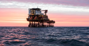 Offshore oil platform sunset
