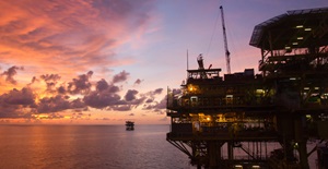 Oil and gas platform in South China Sea at sunset