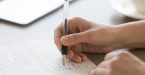 Hand signing legal document regulatory permission -695
