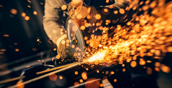 Industrial worker working with metal