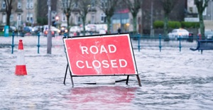 road-flood-closed-sign-under-deep-water-during-bad-extreme-heavy-rain-storm-weather-in-uk card