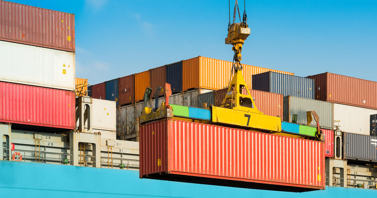 Container being lifted off of ship