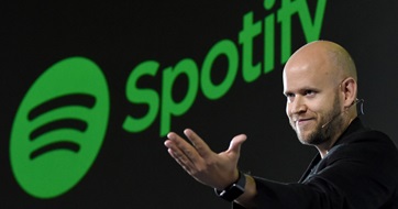 CEO Daniel Ek in front of Spotify logo