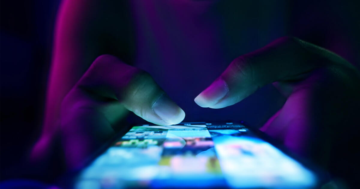 Fingers of a woman using a smartphone