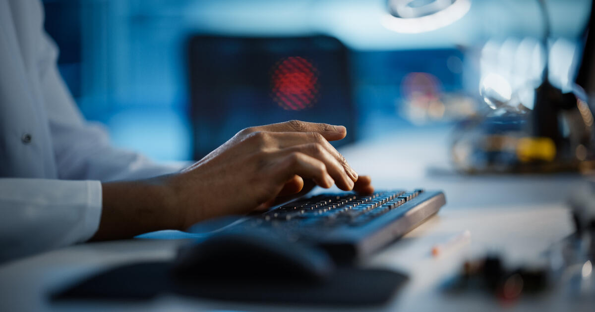 Hands typing on keyboard