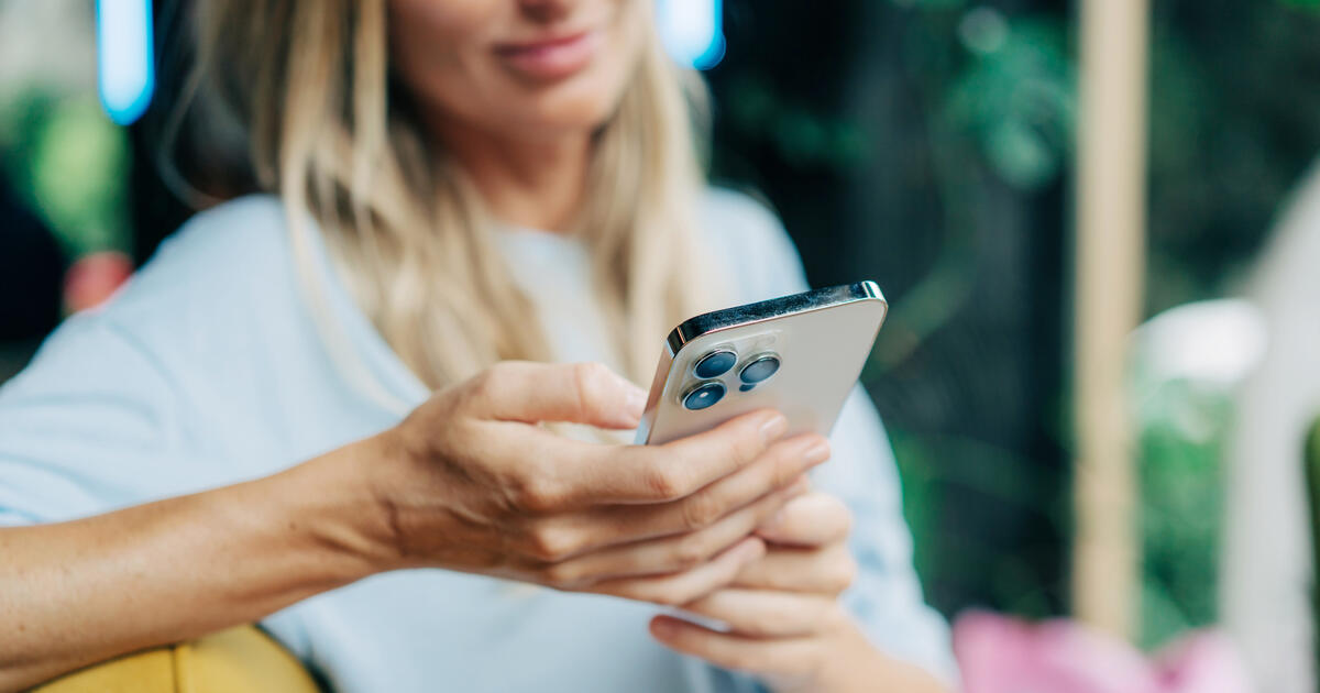 Mobile phone in hands of woman