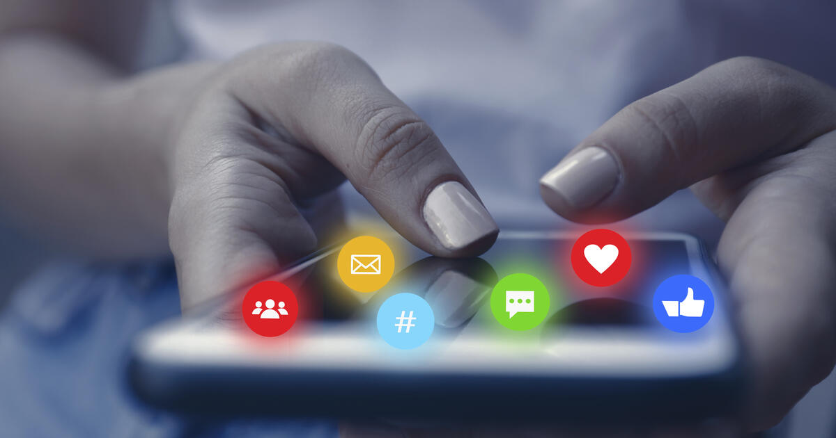 A person using a smartphone with social media