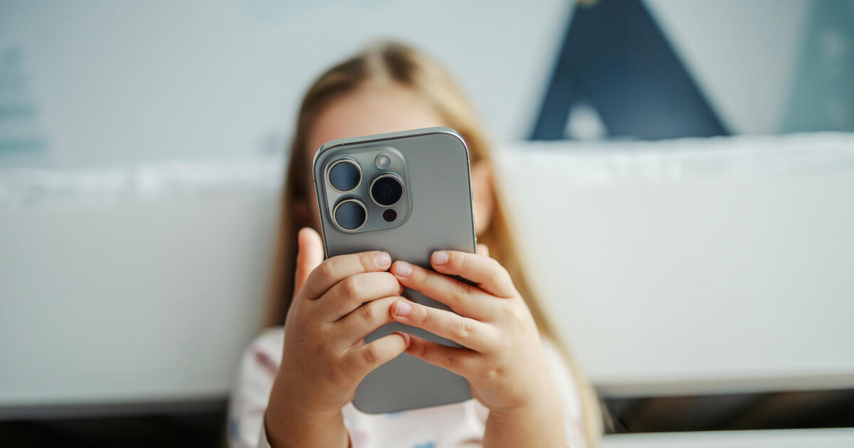 Young child holding phone