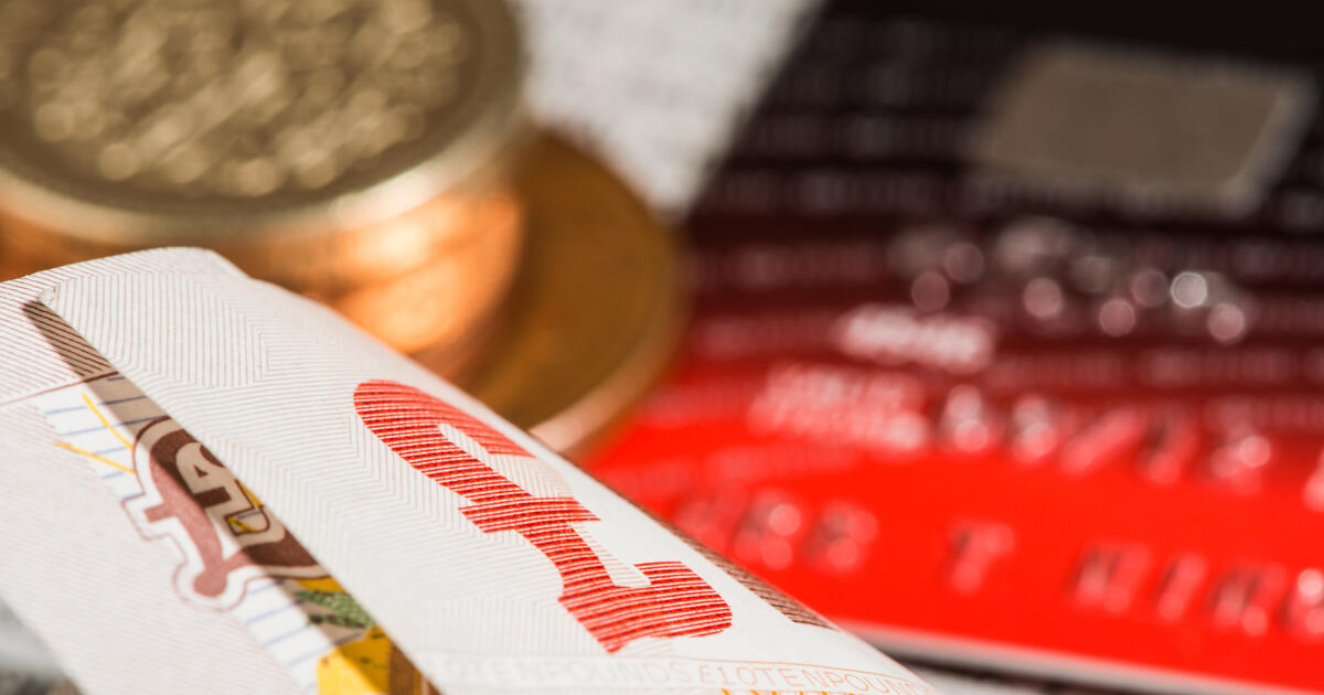 Close-up of British currency and credit cards