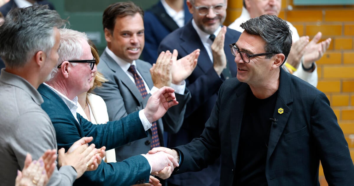 Andy Burnham greets audience member at Manchester speech