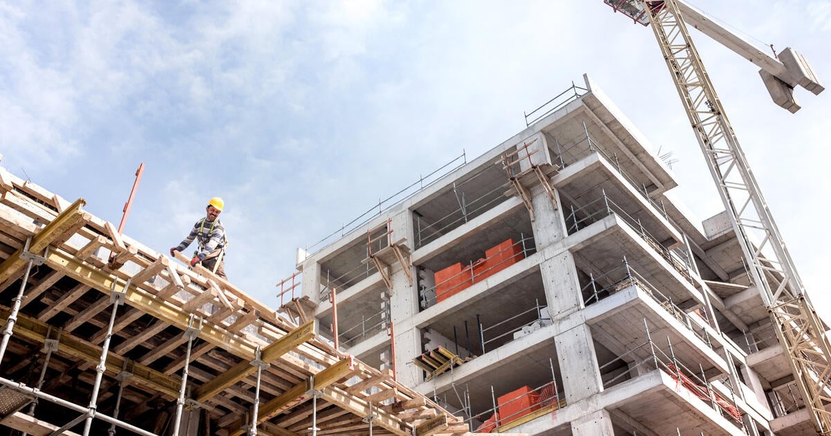 A new building is being constructed with use of tower crane