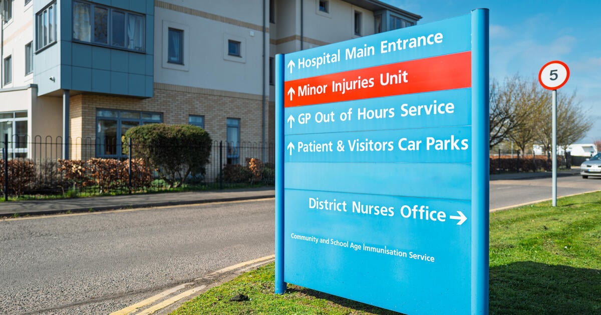 NHS information sign located at the entrance to the large hospital campus