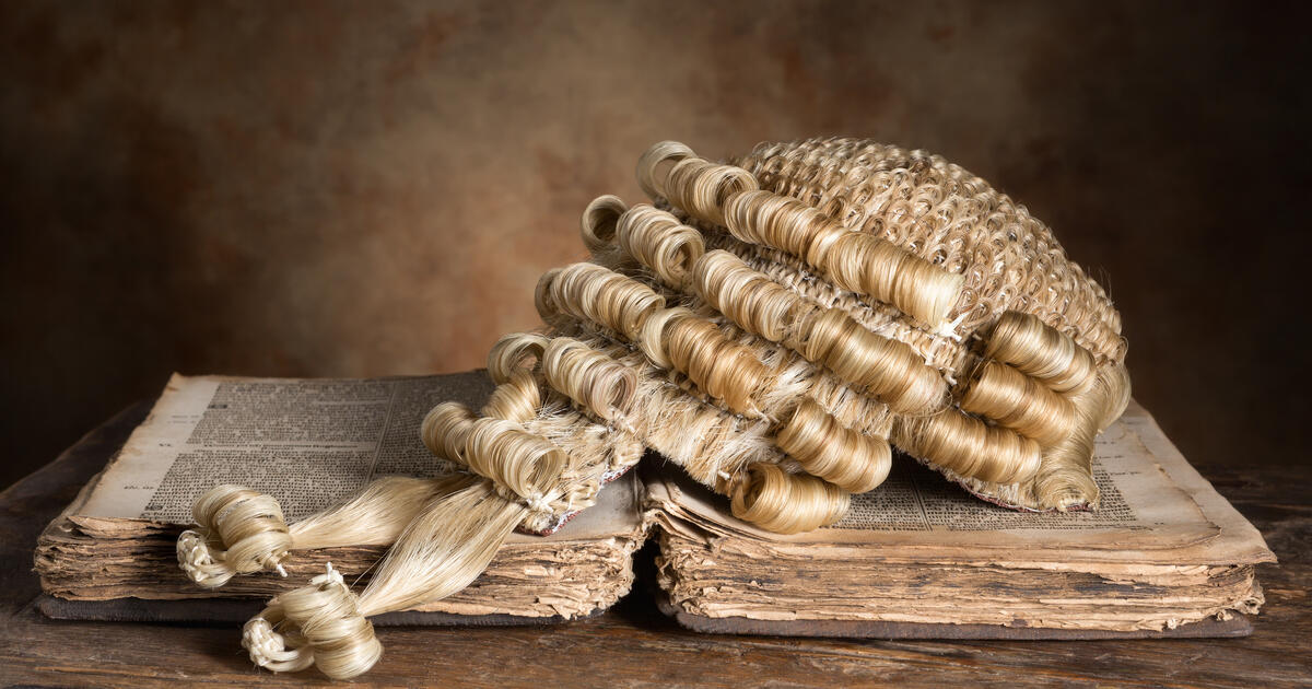 Barrister wig on old book