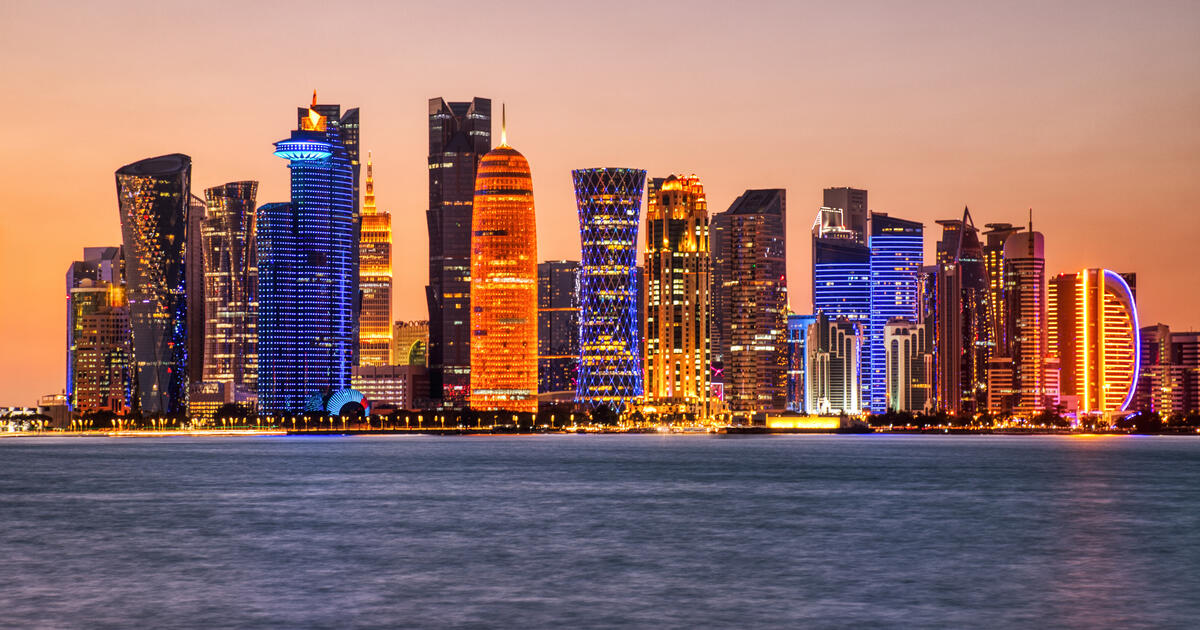 Doha skyscrapers illuminated at sunset_Digital - SEOSocialEditorial image