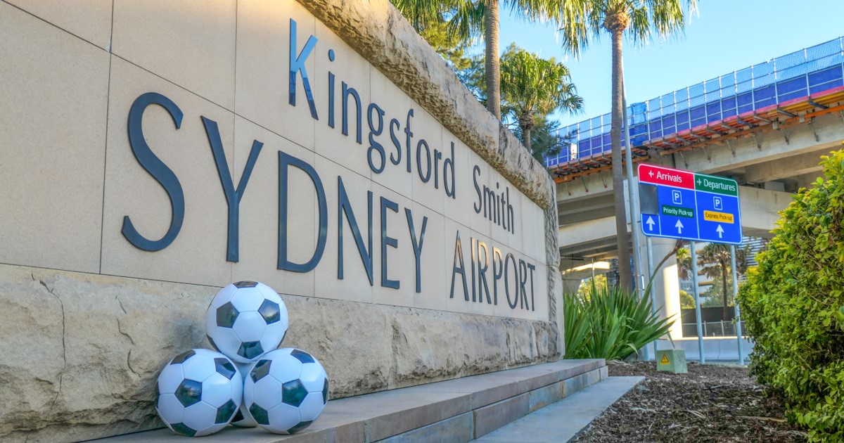 Footballs at Sydney airport entry sign seo