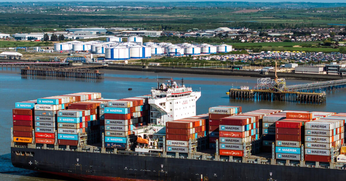 Container ship the Nansha Express makes its way on the River