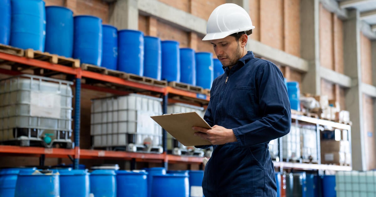 Foreman supervising the operation of a chemical plant - SEOSocialEditorial image