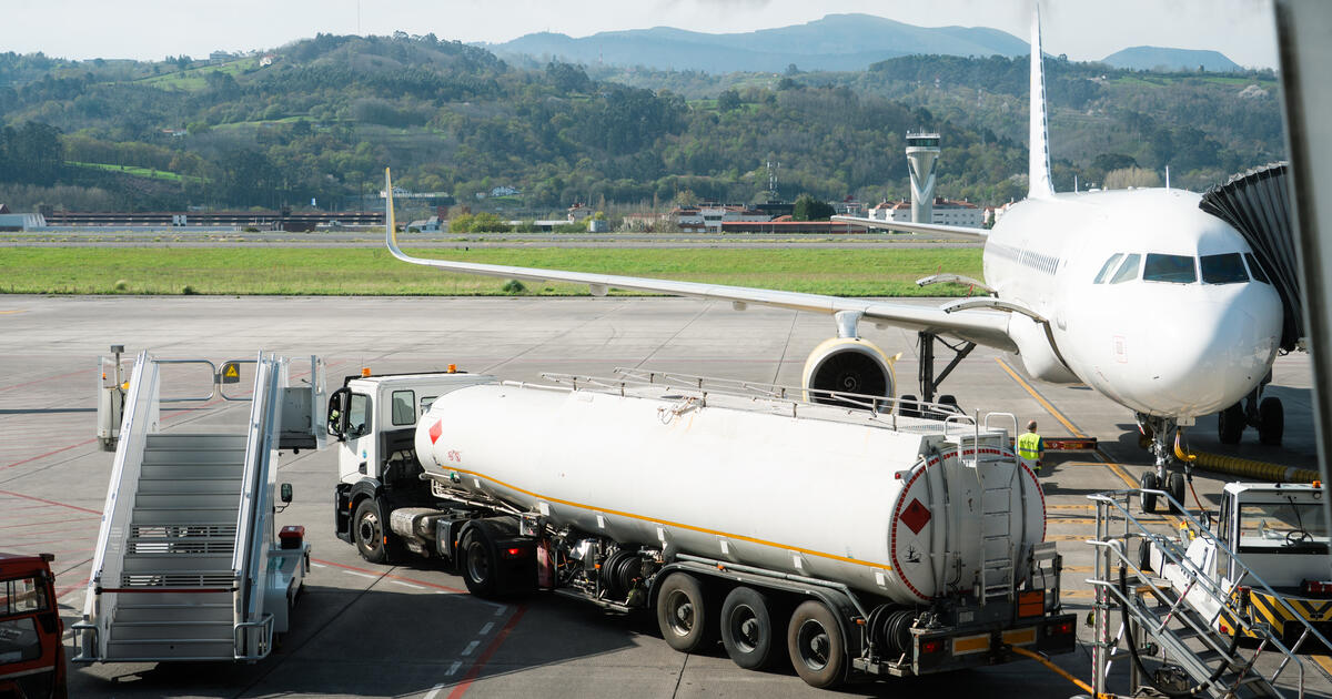 Fuel truck next to aircraft at airport_Digital - SEOSocialEditorial image