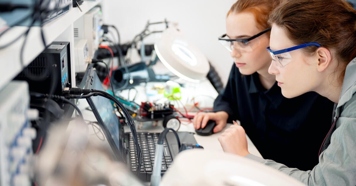 Female university students in an electronic engineering class in the university’s electronics laboratory.