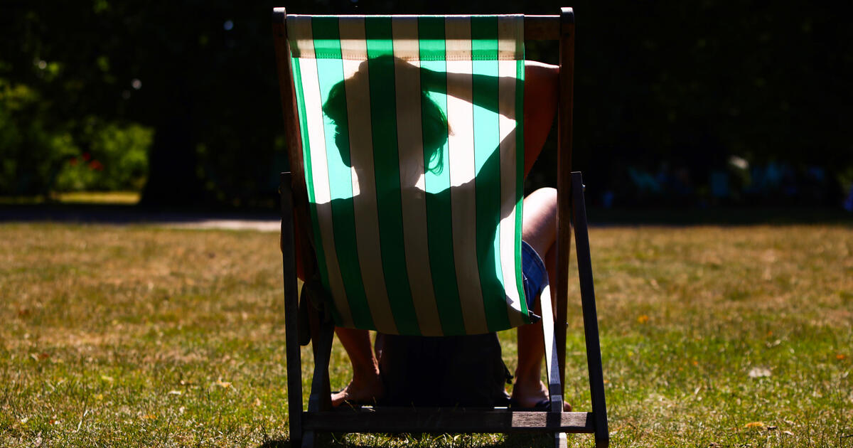A person sleeps in a deckchair in St James's Park during the UK heatwave. Photo: Alishia Abodunde/Getty Images