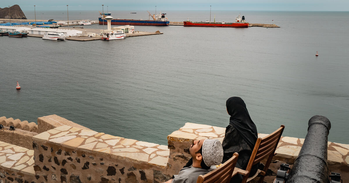 Two bulk carriers sit anchored at Muscat Anchorage near the Strait of Hormuz 