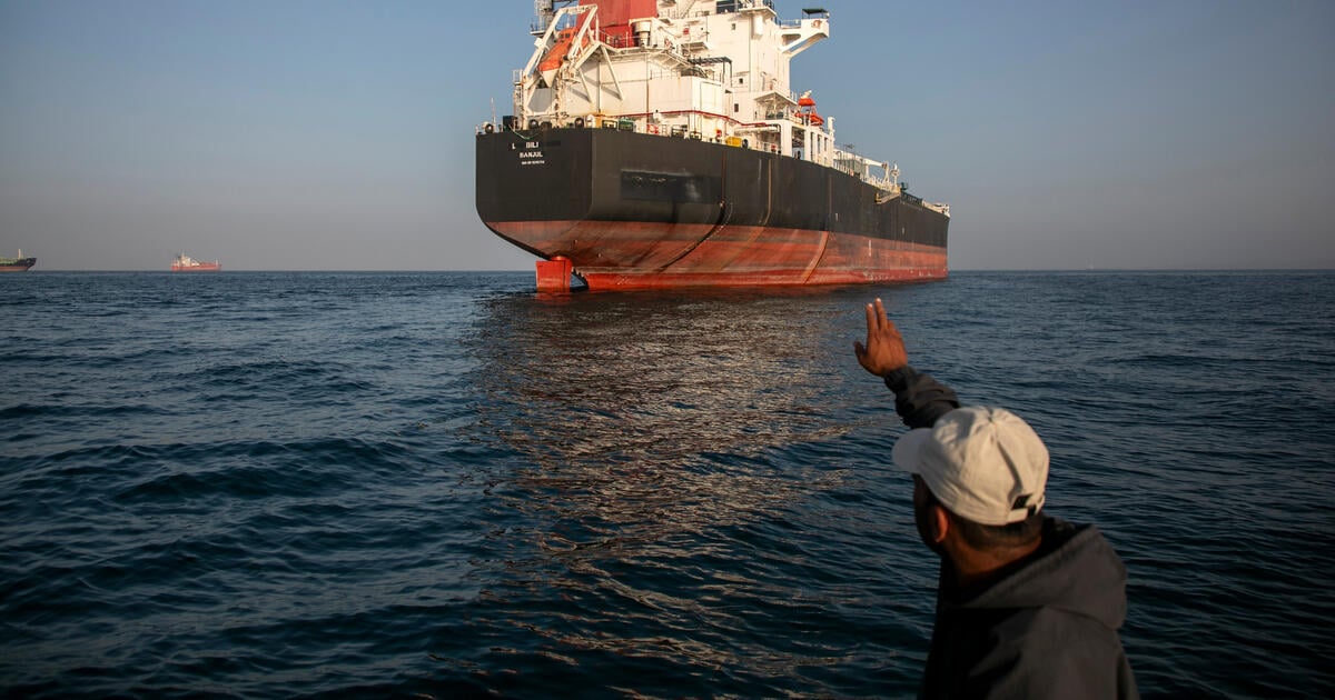 A ship remains anchored in the Strait of Hormuz near Larak Island, Iran