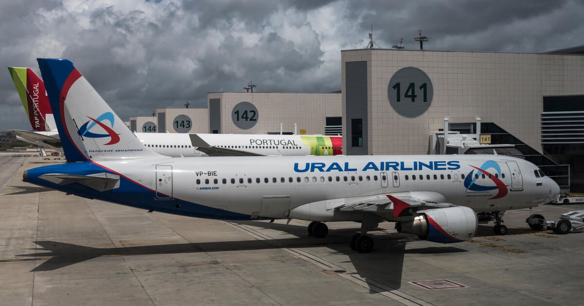 A Russian Ural Airlines A320 in front of a Portugese flag carrier TAP's airplane at Lisbon Humberto Delgado Airport. 