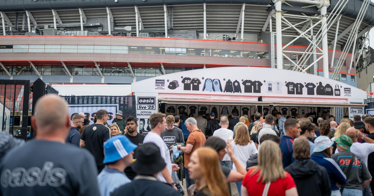 Fans gather for Oasis' live tour at the Principality Stadium on July 5, 2025 in Cardiff, Wales