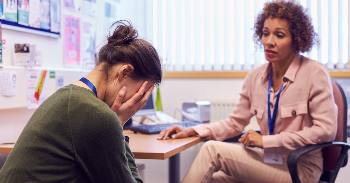 Female college student meeting with campus counsellor