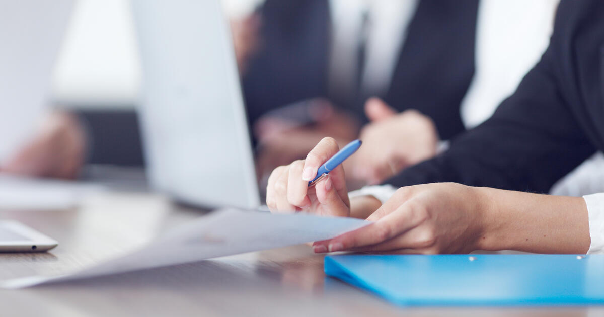 Close-up of Business people working together at a meeting