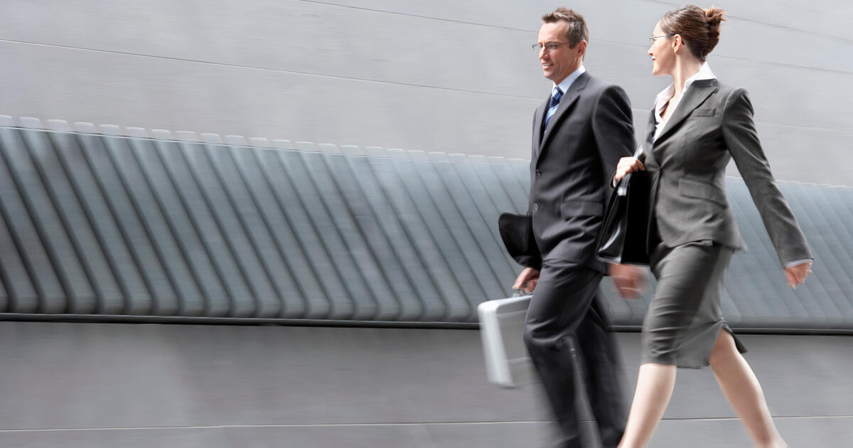 Full length of two business colleagues in discussion. - SEOSocialEditorial image