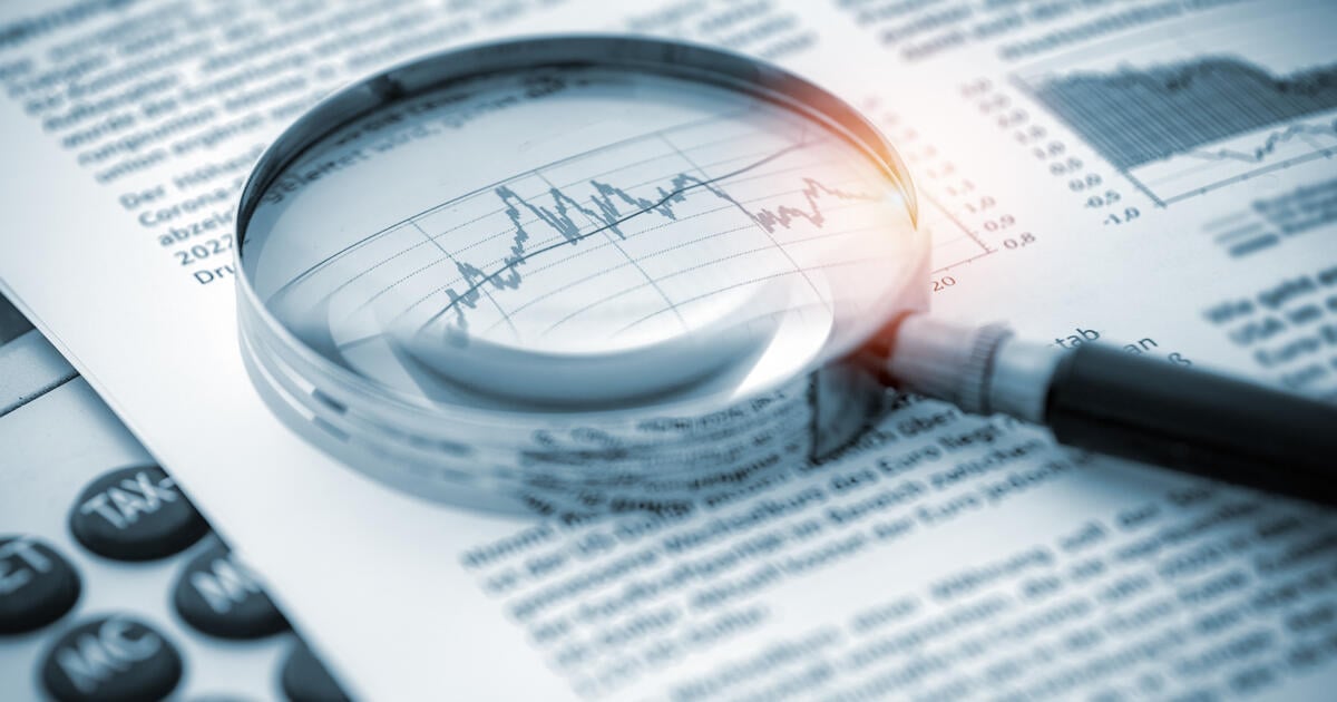Magnifying glass on financial chart