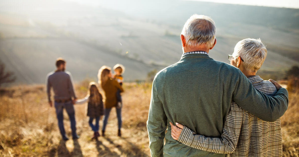 Retired couple observe family